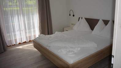 Bett in den Apartements vom Wiesenhof